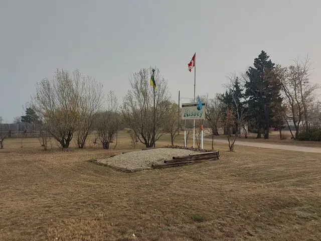 Kisbey welcome sign and flags